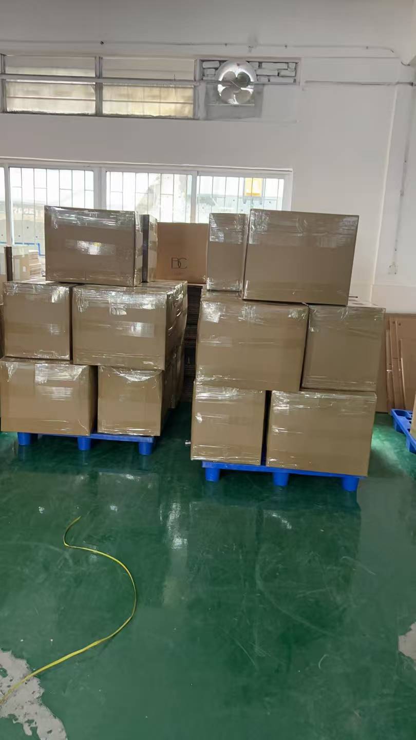 Warehouse workers repacking cartons for international shipping